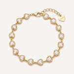 CADUCCI Amore Bracelet in gold with heart-cut crystals and a heart charm engraved with the CADUCCI logo