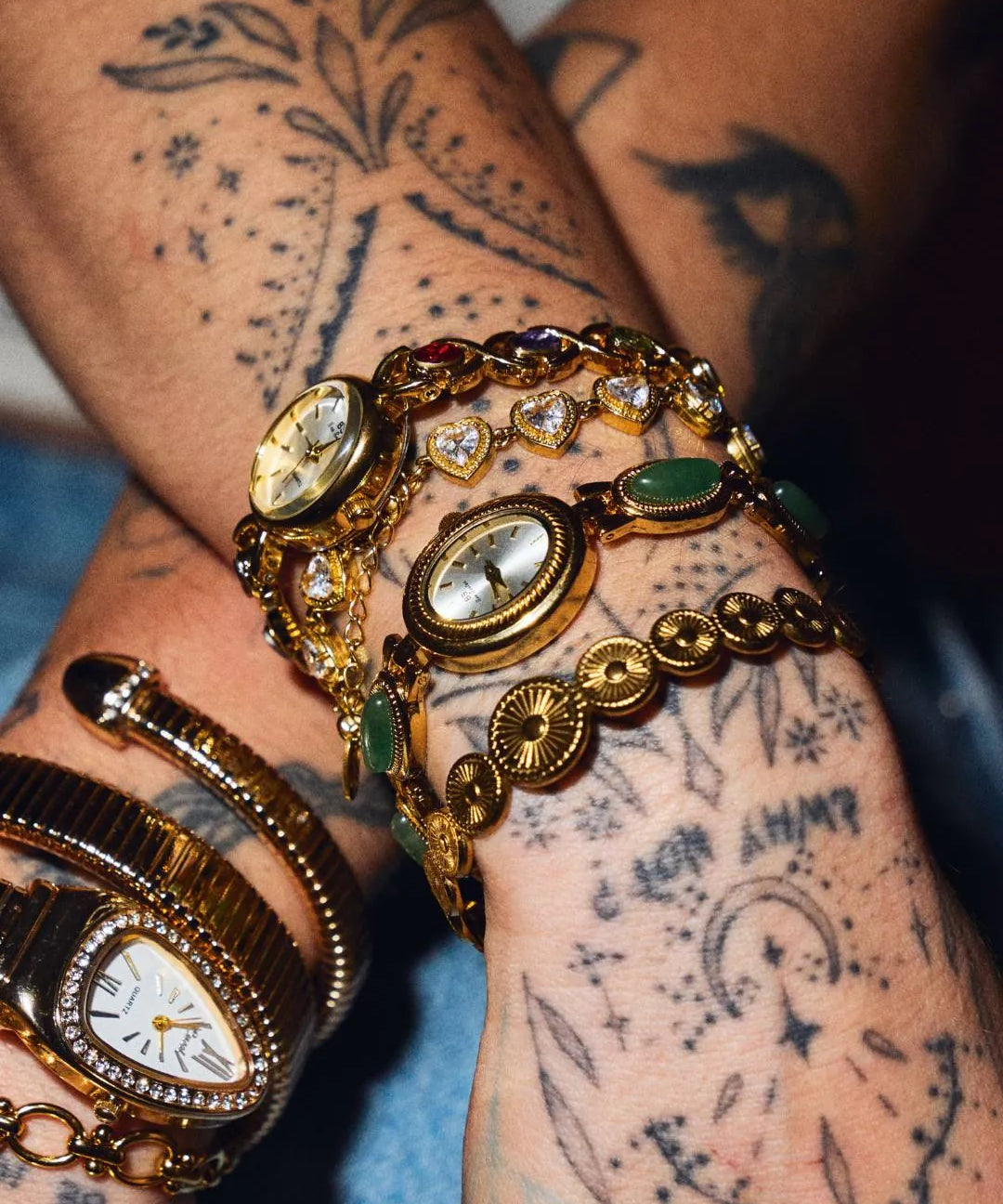 CADUCCI Amore Bracelet in gold worn in a wrist stack with vintage gold watches