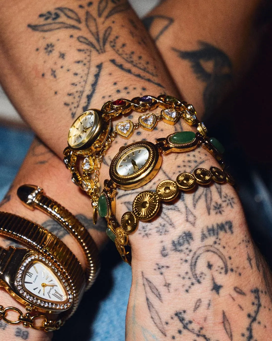 CADUCCI Amore Bracelet in gold worn in a wrist stack with vintage gold watches