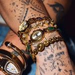 CADUCCI Amore Bracelet in gold worn in a wrist stack with vintage gold watches