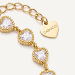 CADUCCI Amore Bracelet in gold, close-up of the heart charm engraved with the CADUCCI logo