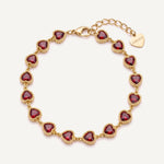 CADUCCI Amore Bracelet in gold with red heart-cut stones and a heart charm engraved with the CADUCCI logo