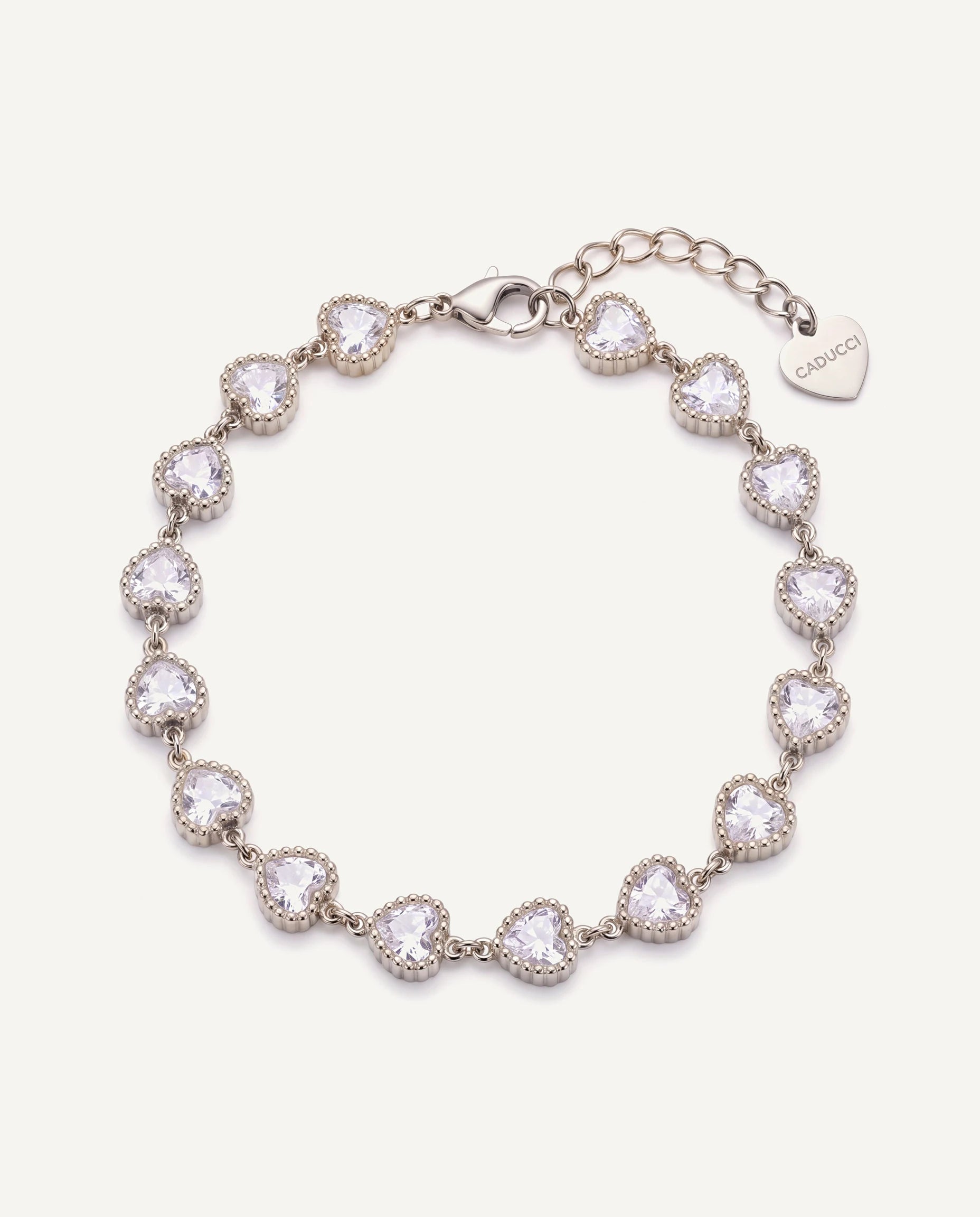 CADUCCI Amore Bracelet in silver with heart-cut crystals and a heart charm engraved with the CADUCCI logo
