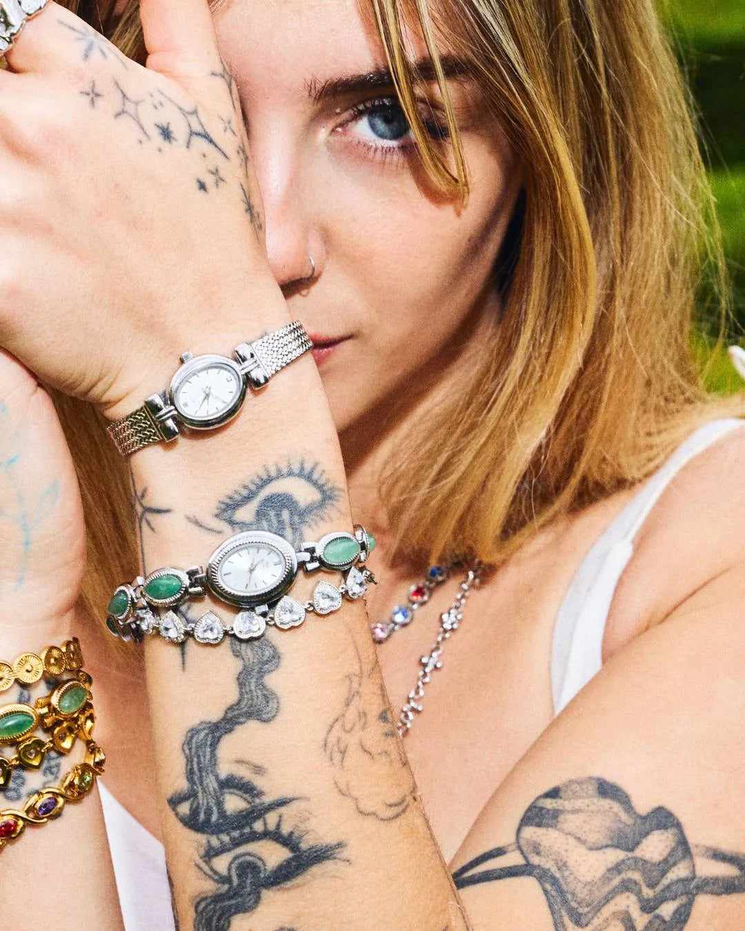 CADUCCI Amore Bracelet in silver worn on the wrist with a silver watch