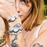 CADUCCI Amore Bracelet in silver worn on the wrist with a silver watch