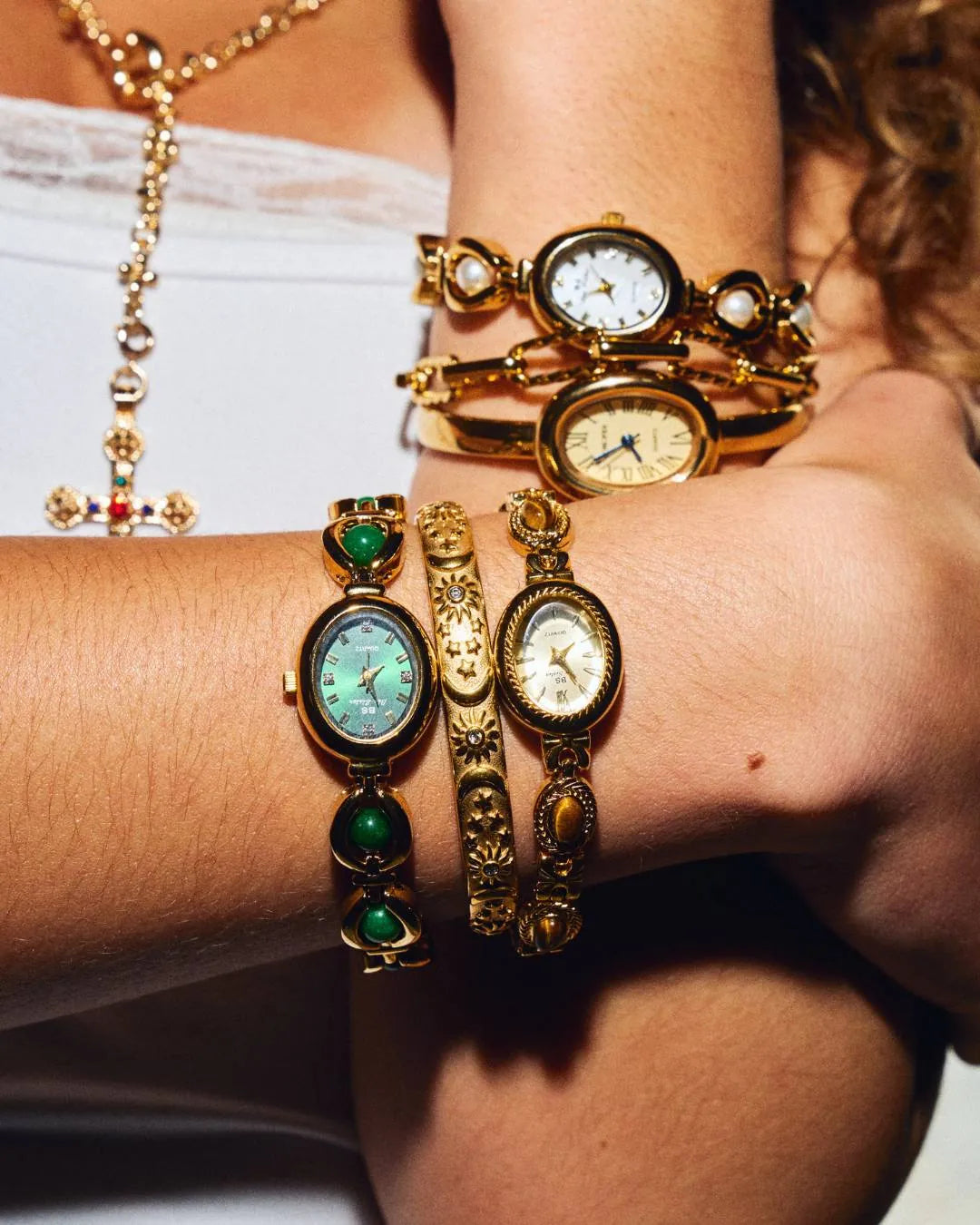 CADUCCI Belluno Bracelet in gold worn on the wrist next to CADUCCI watches