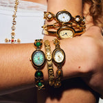 CADUCCI Belluno Bracelet in gold worn on the wrist next to CADUCCI watches