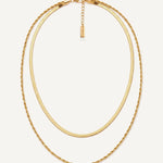 CADUCCI Firenze Necklace in gold, layered: a thin herringbone chain and a fine rope chain, with a rectangular tag engraved with the CADUCCI logo