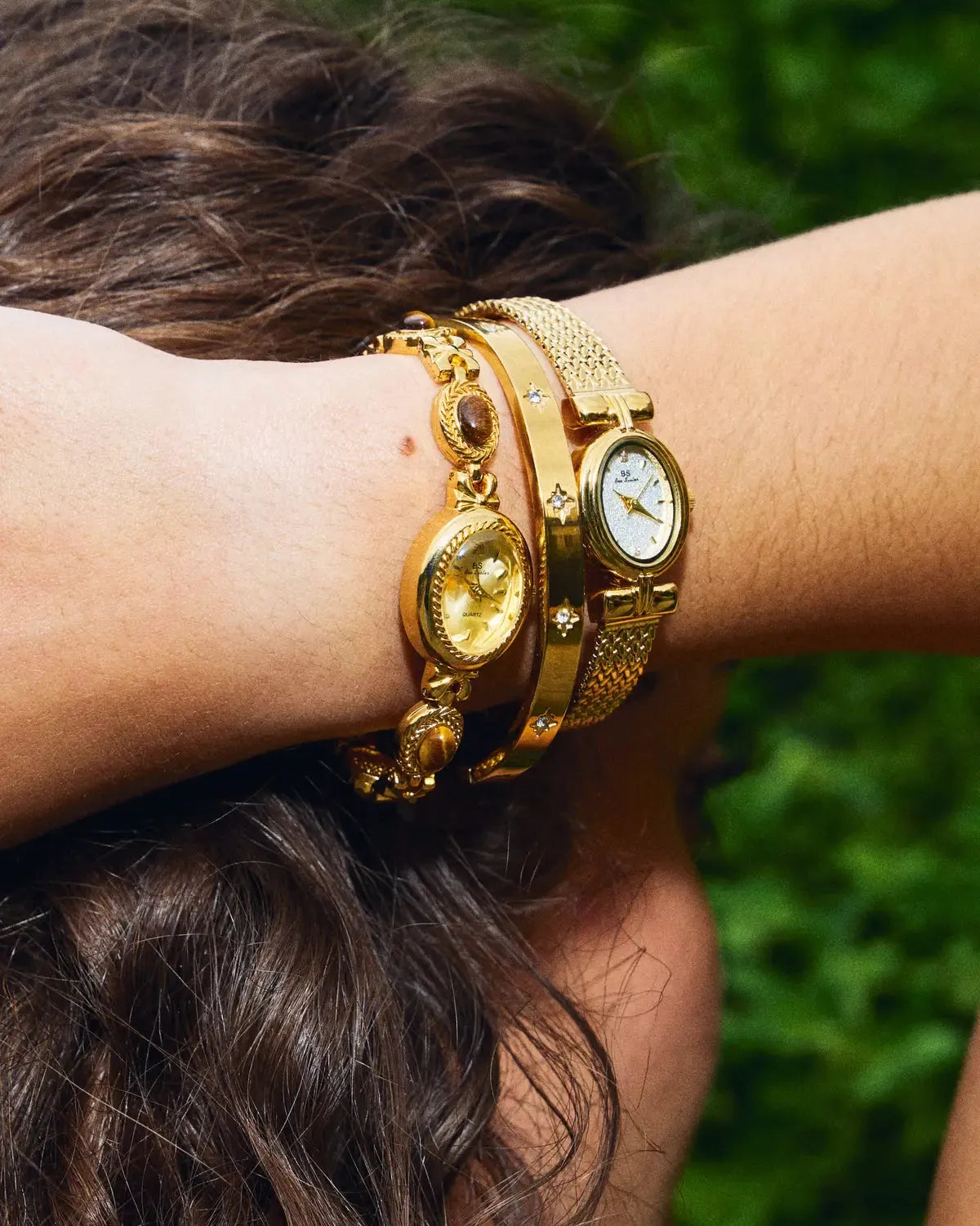 CADUCCI Venezia Bracelet in gold worn in a stack with a vintage gold watch